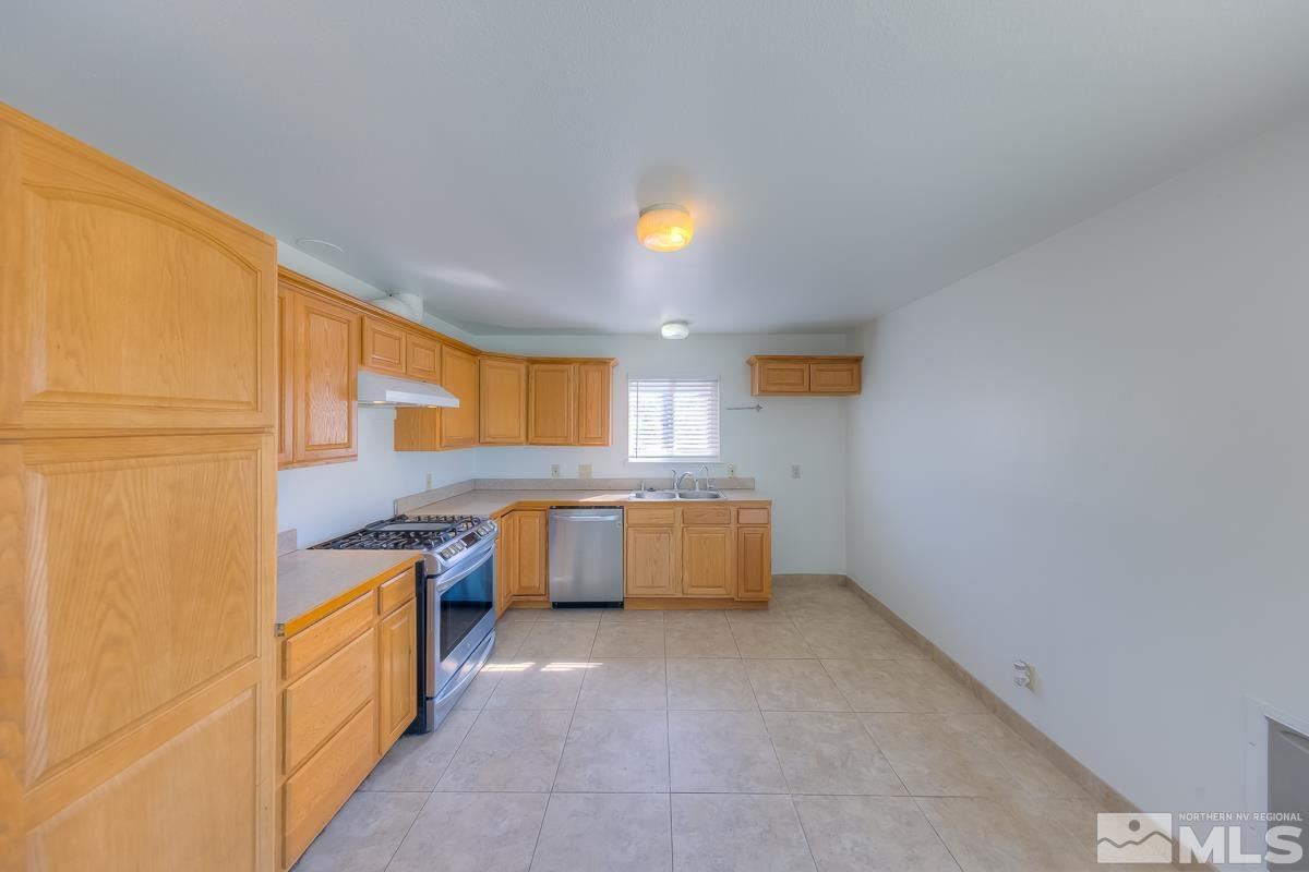 3504 Sun Cloud Circle Reno, NV 89506 - Photo 8 of 26 a kitchen with a sink and counter top
