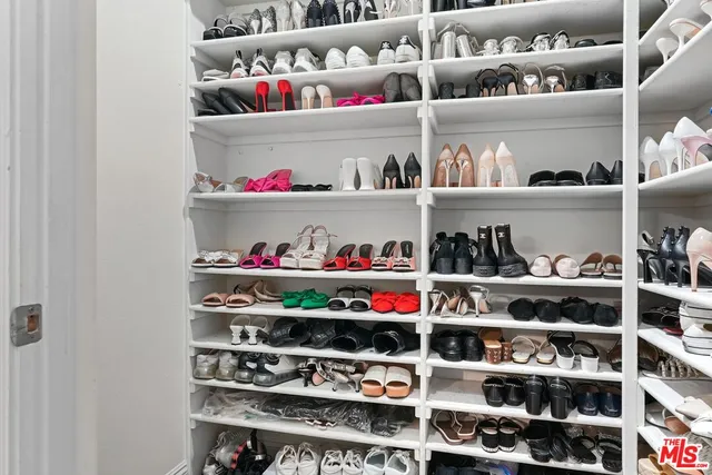 a shelf with cup and plates