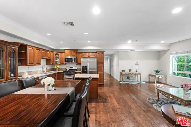 an open kitchen with dining table and chairs