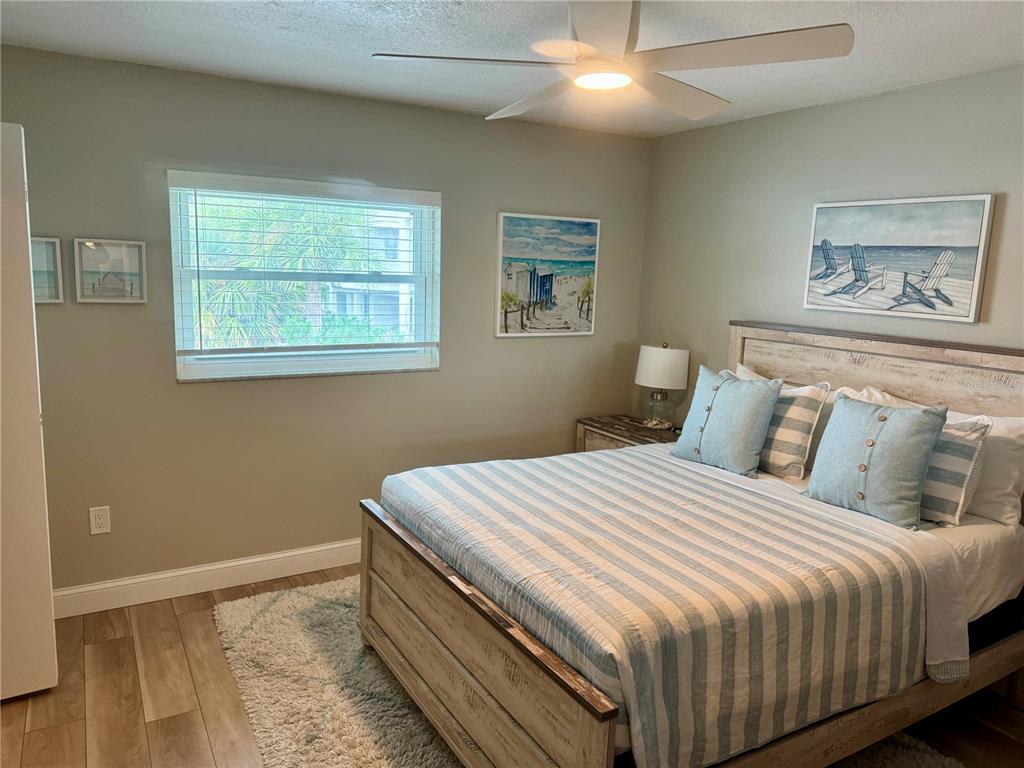 10 164th Avenue, Unit 11 Redington Beach, FL 33708 - Photo 19 of 30 a bedroom with a bed and a window