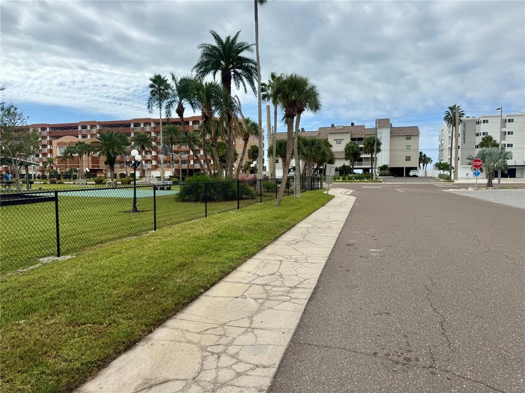 10 164th Avenue, Unit 11 Redington Beach, FL 33708 - Photo 27 of 30 a view of a park with swings and slides