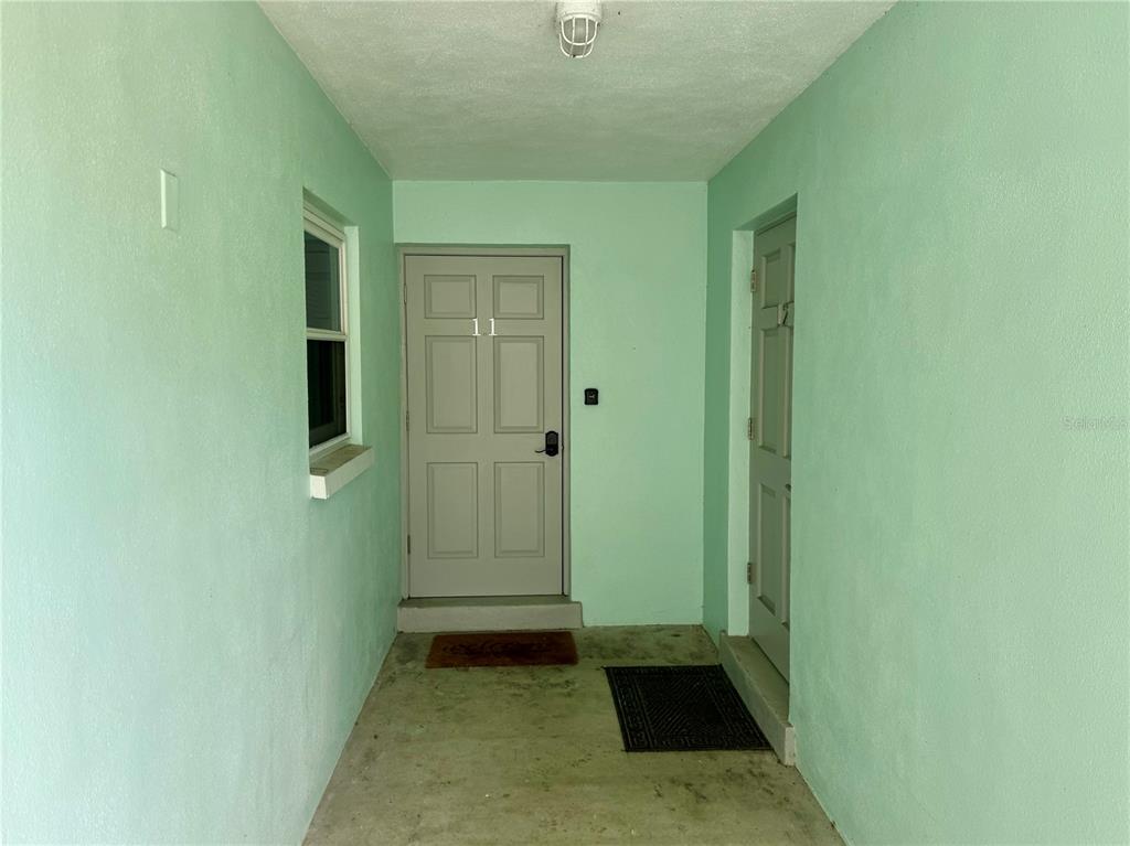 10 164th Avenue, Unit 11 Redington Beach, FL 33708 - Photo 4 of 30 a view of an empty room with closet