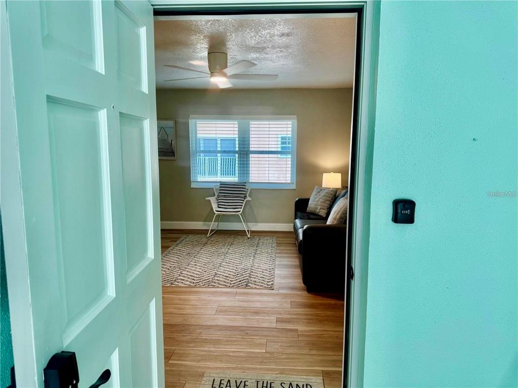 10 164th Avenue, Unit 11 Redington Beach, FL 33708 - Photo 5 of 30 a living room with furniture and a window