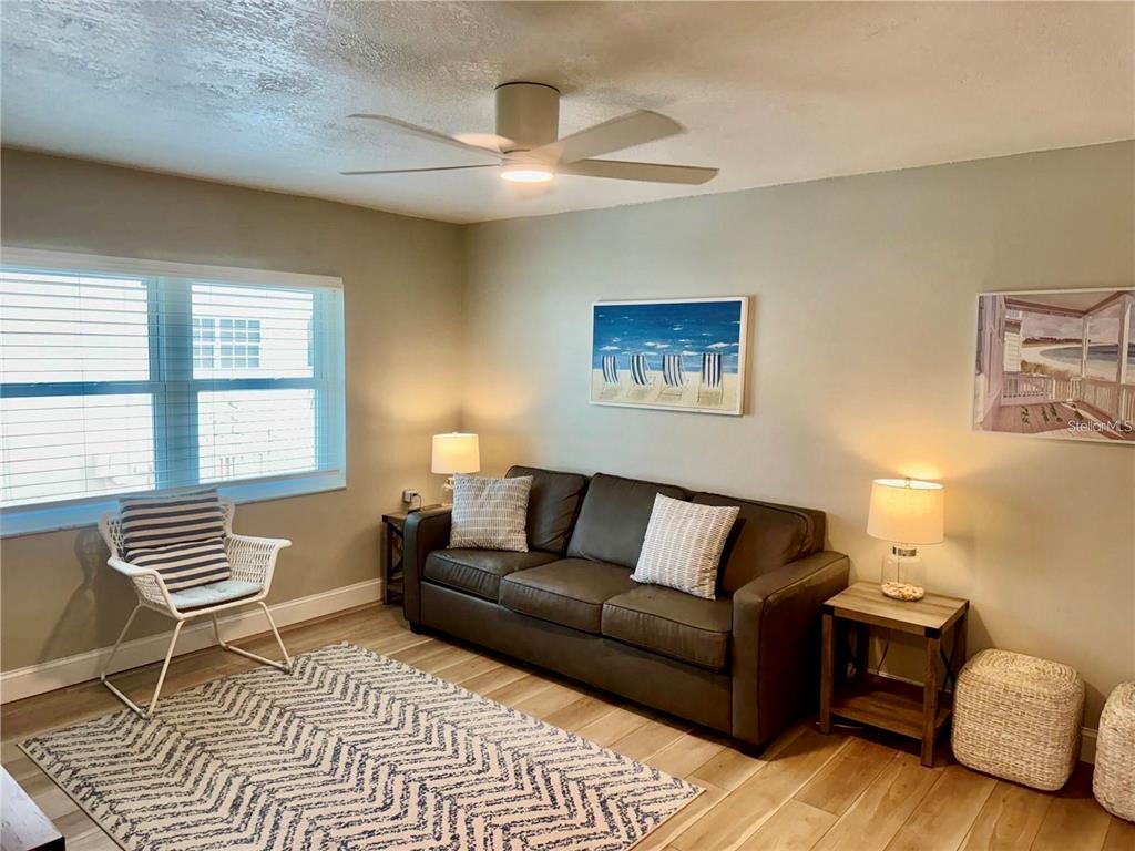 10 164th Avenue, Unit 11 Redington Beach, FL 33708 - Photo 9 of 30 a living room with furniture and a window