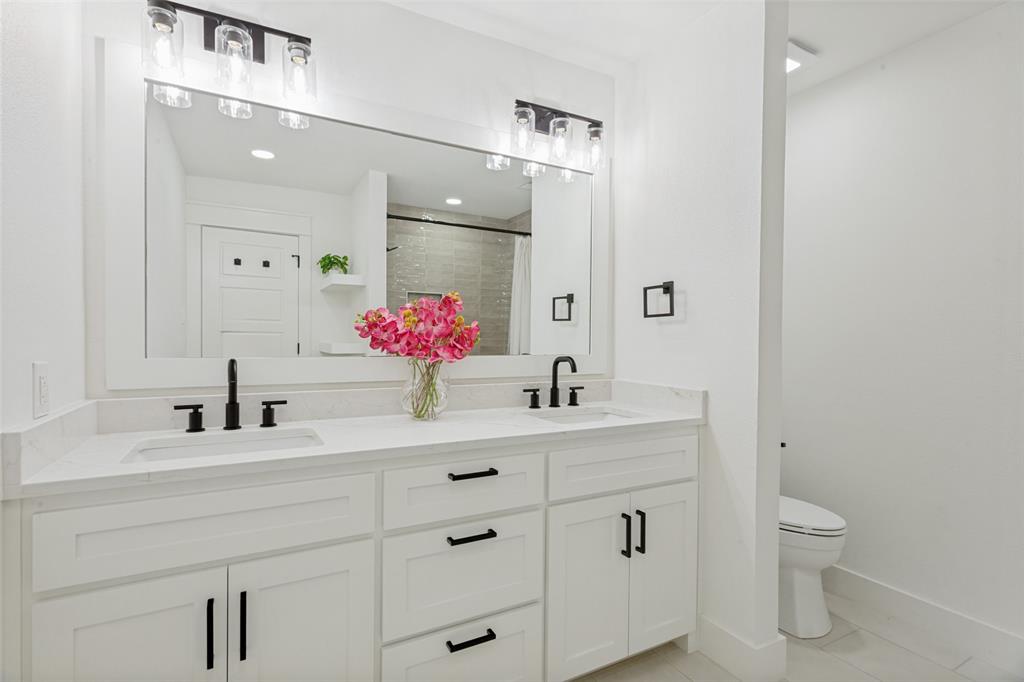4316 Springbranch Drive Benbrook, TX 76116 - Photo 30 of 39 Dual white vanity with quartz countertops and integrated sinks