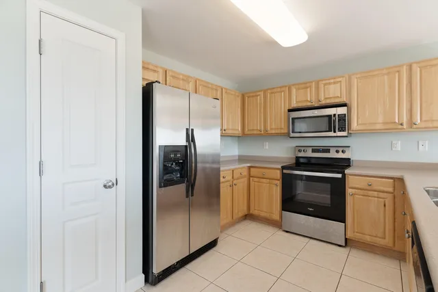 a kitchen with a sink and large window