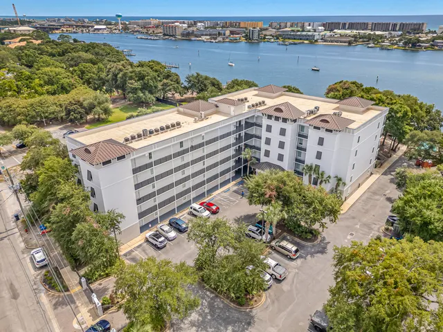 an aerial view of a house with a lake view