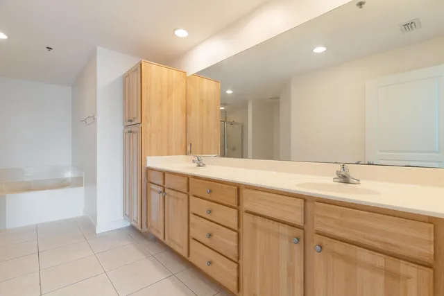 a bathroom with a tub and shower