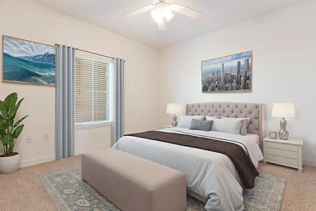 an empty room with a ceiling fan and closet area