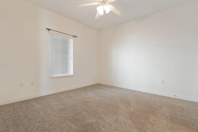a bathroom with a toilet a sink and a mirror