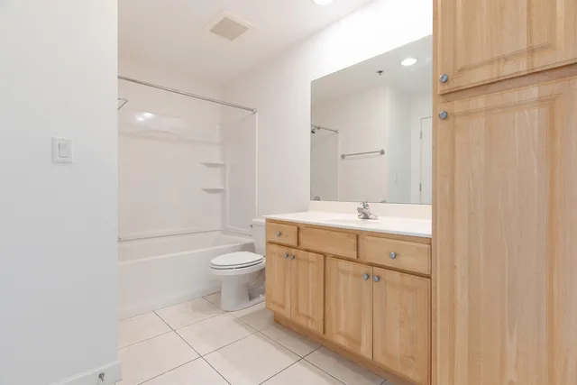 a bathroom with a sink a mirror and a shower