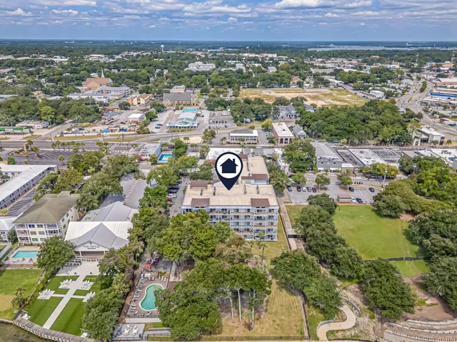a patio with swimming pool table and chairs