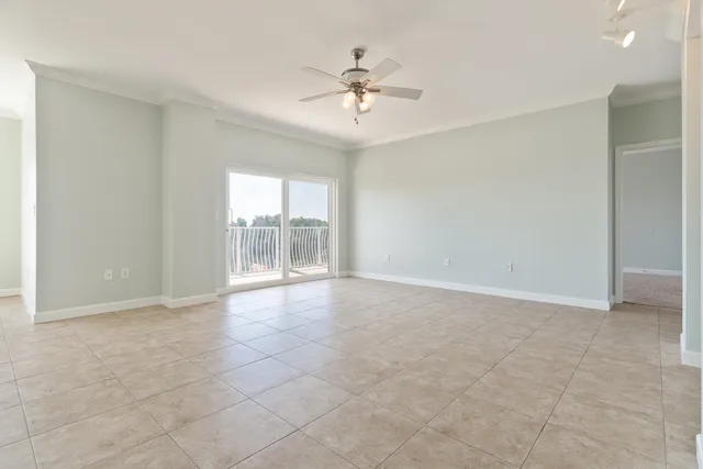 a view of a kitchen with a sink and a refrigerator