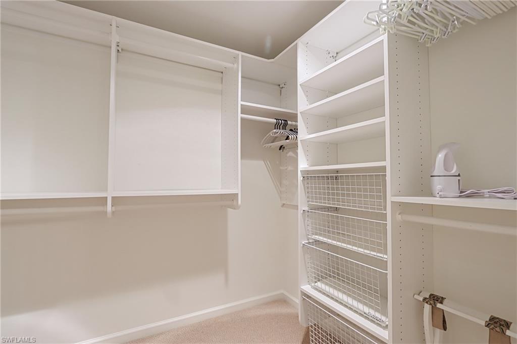 60 Seagate Drive, Unit 704 Naples, FL 34103 - Photo 15 of 28 a bathroom with a shower