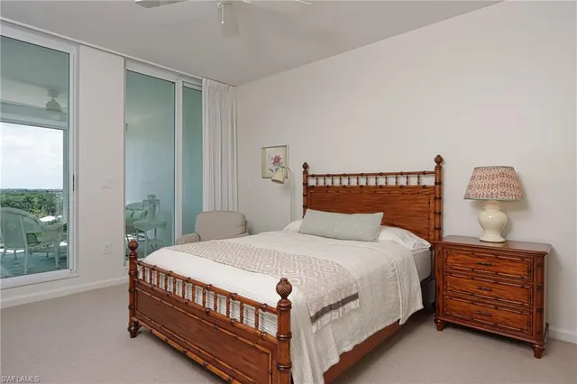 a bedroom with a bed a window and couch