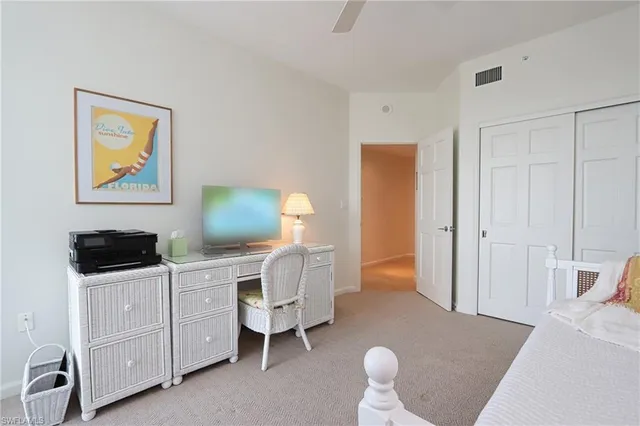 a bedroom with a bed and a cabinets