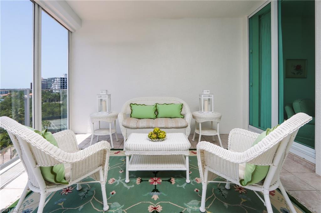 60 Seagate Drive, Unit 704 Naples, FL 34103 - Photo 23 of 28 a view of a dining room with furniture window and outside view