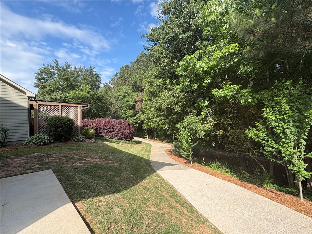 5934 Watersdown Way Flowery Branch, GA 30542 - Photo 4 of 28 a view of a backyard