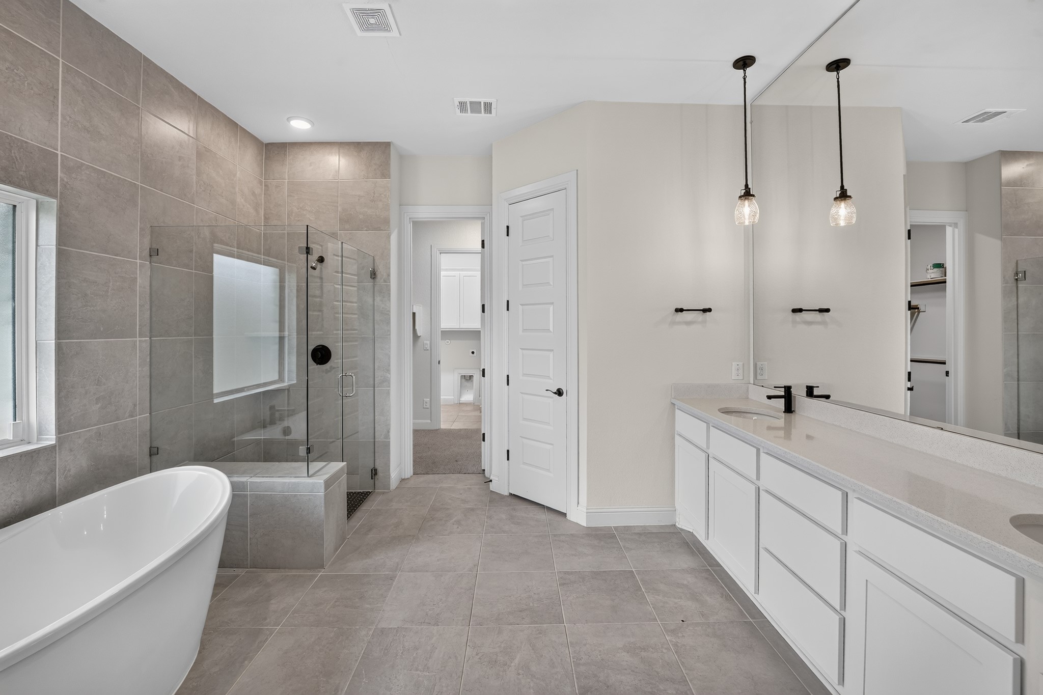 508 Pinnacle View Drive Georgetown, TX 78628 - Photo 19 of 27 A spacious primary bathroom boasts a separate shower, a generous double vanity, and a freestanding soaking tub.