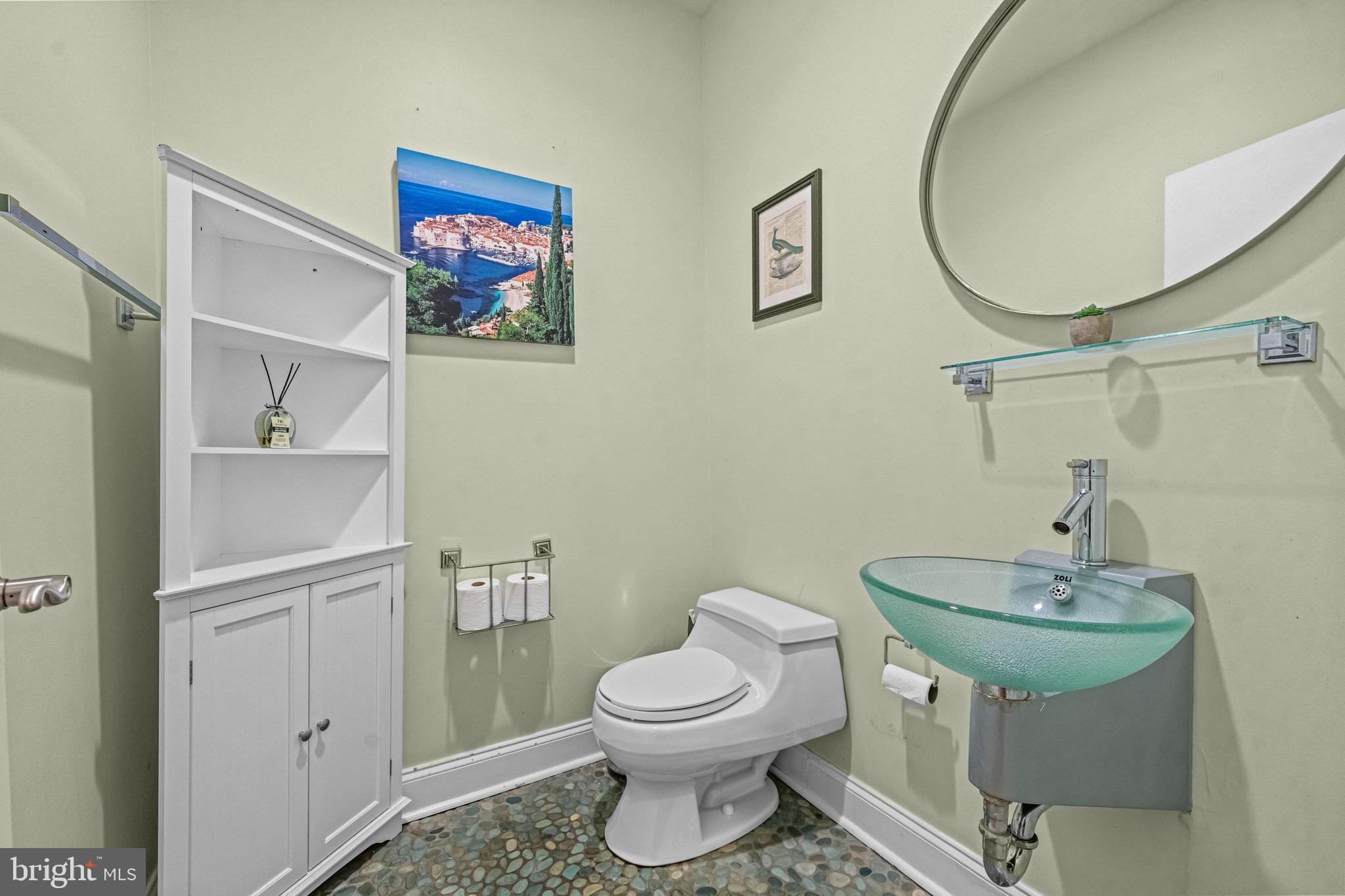 116 Quarry Street Philadelphia, PA 19106 - Photo 15 of 57 a bathroom with a toilet a sink and a mirror