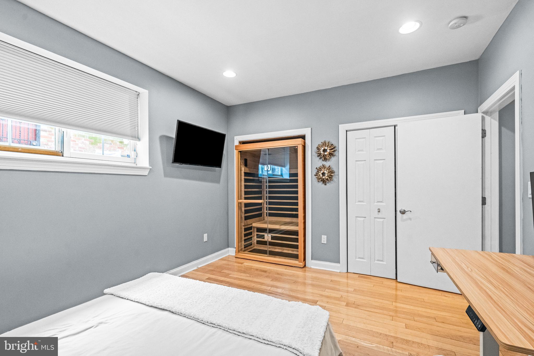 116 Quarry Street Philadelphia, PA 19106 - Photo 18 of 57 a bedroom with a bed and a flat screen tv