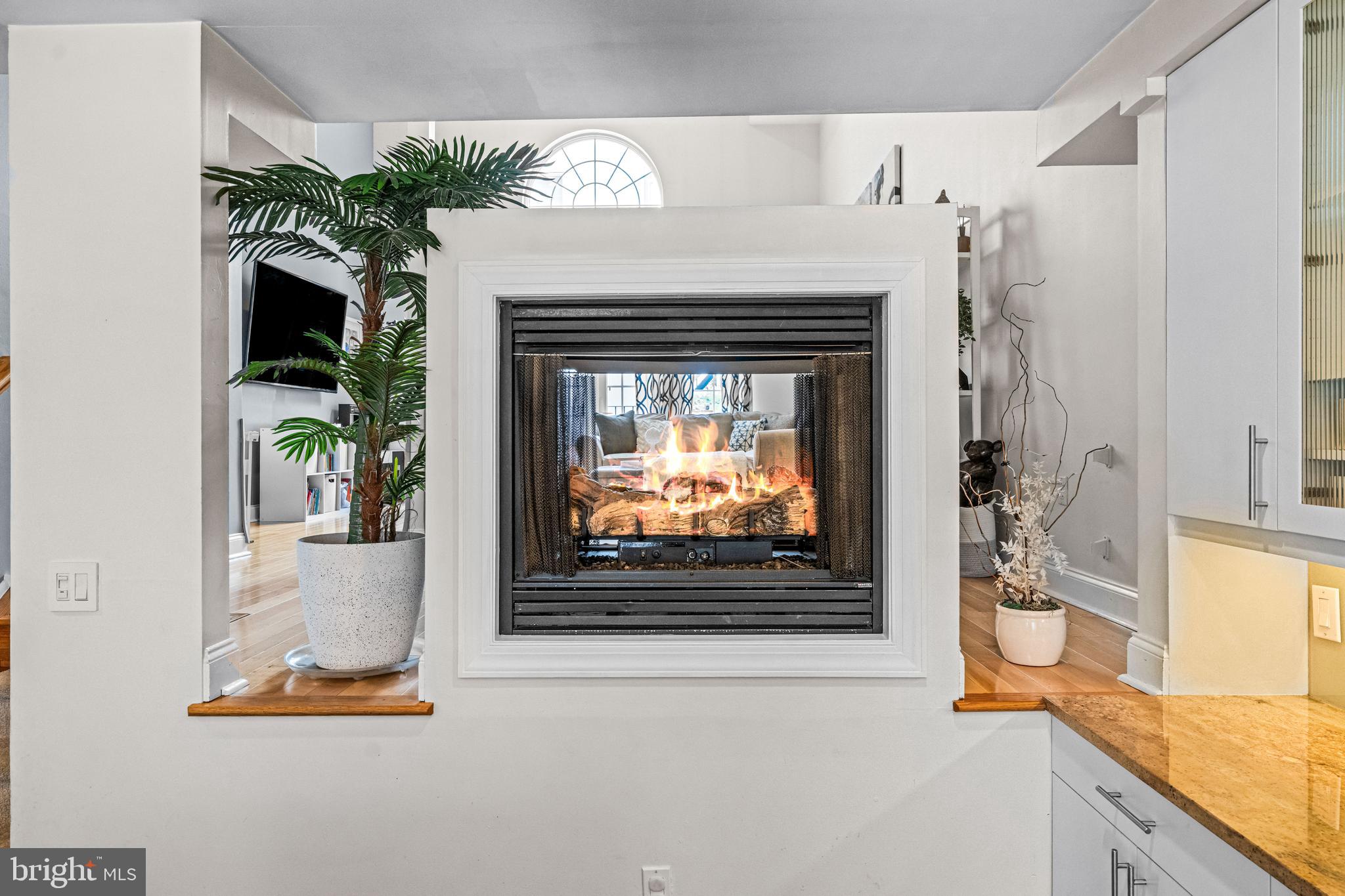 116 Quarry Street Philadelphia, PA 19106 - Photo 30 of 57 a living room with a fireplace and a flat screen tv