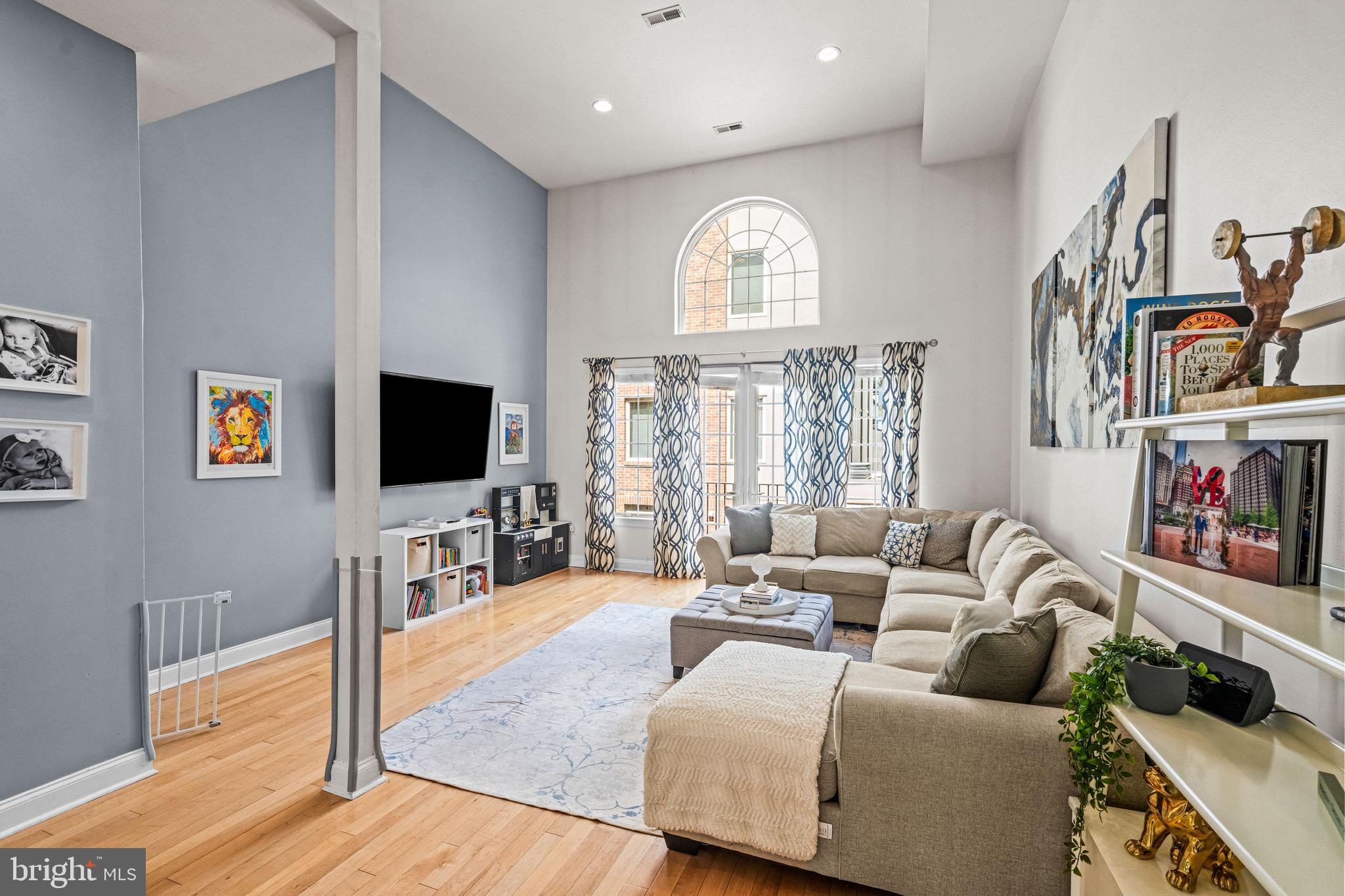 116 Quarry Street Philadelphia, PA 19106 - Photo 32 of 57 a living room with furniture a flat screen tv and a large window