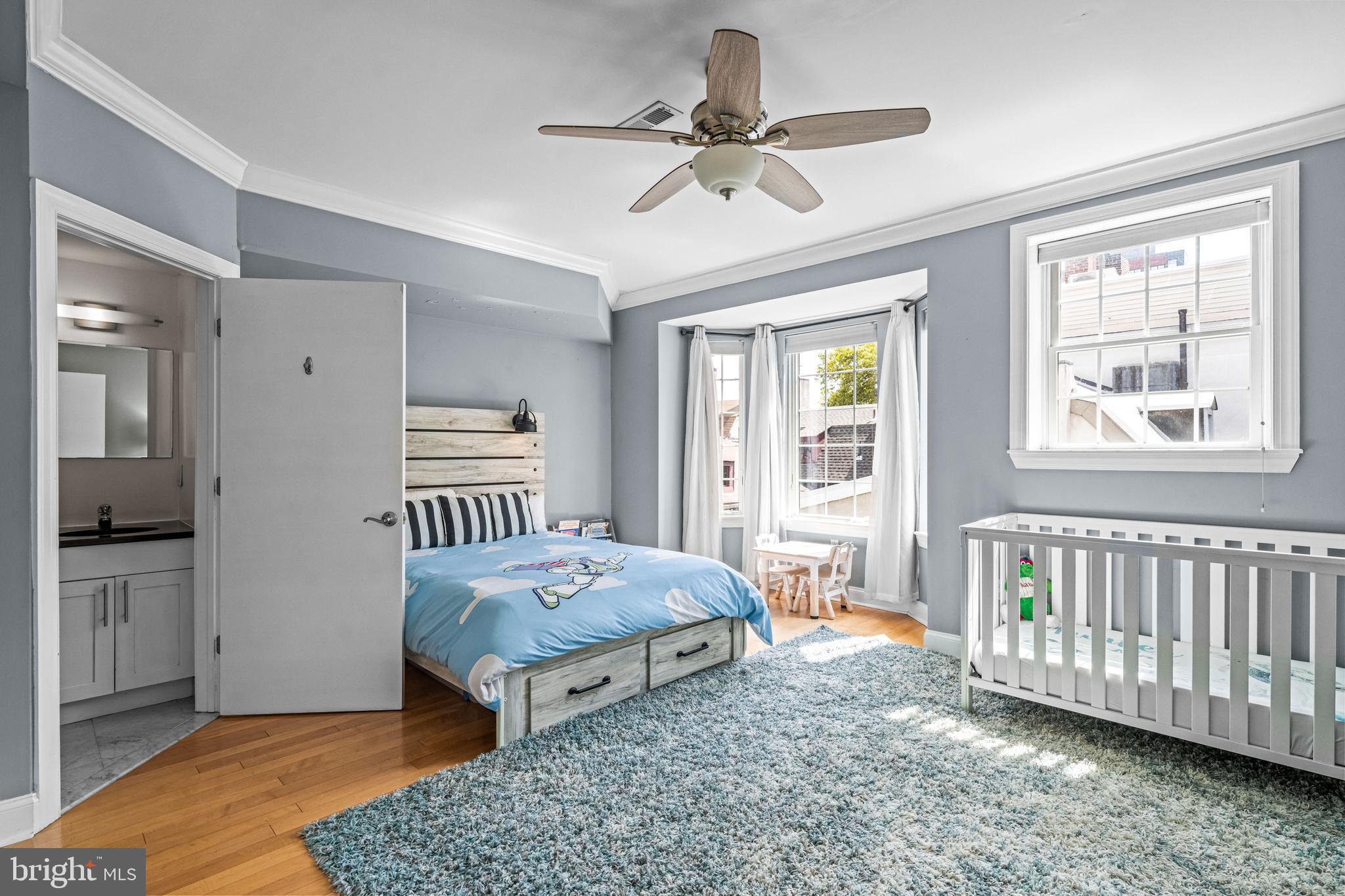 116 Quarry Street Philadelphia, PA 19106 - Photo 38 of 57 a bedroom with a bed and wooden floor