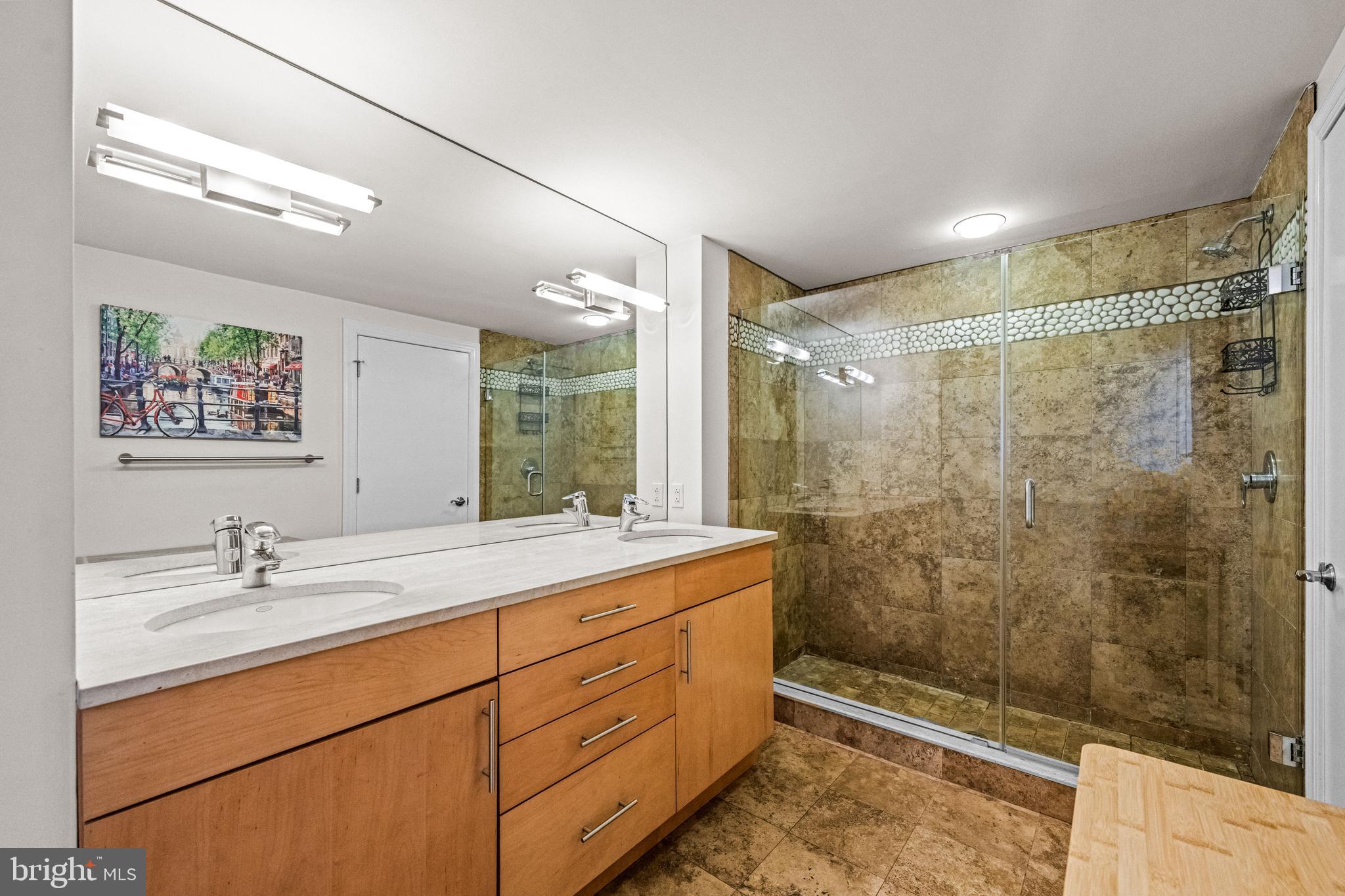 116 Quarry Street Philadelphia, PA 19106 - Photo 46 of 57 a bathroom with a double vanity sink toilet and shower