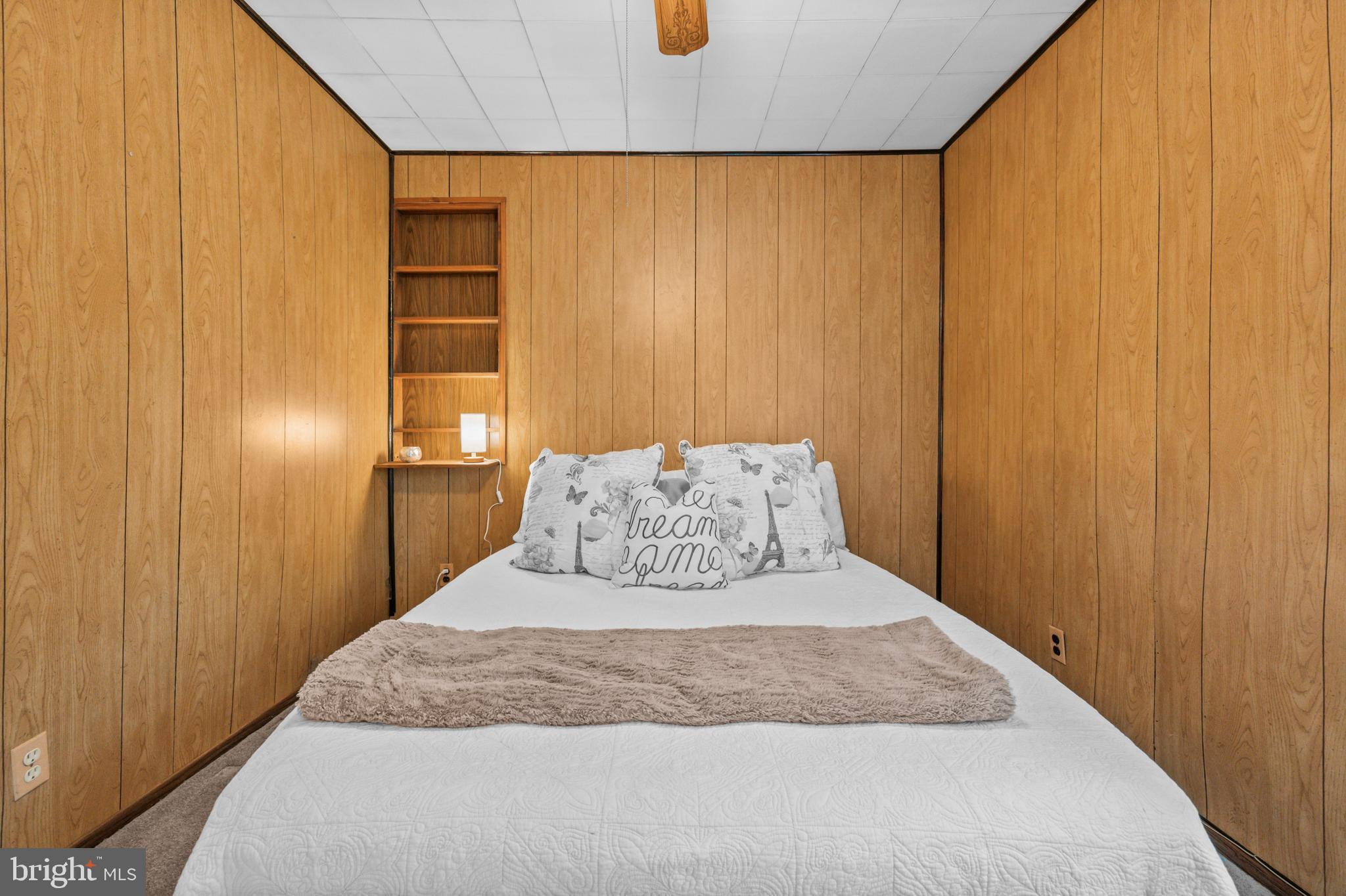 4 Russell Road Cabin John, MD 20818 - Photo 21 of 56 a bedroom with a bed and wooden floor