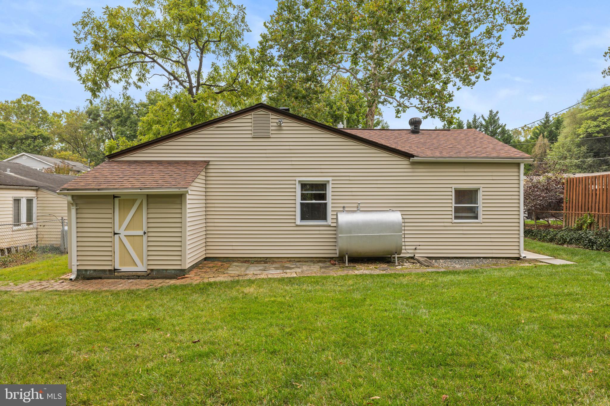 4 Russell Road Cabin John, MD 20818 - Photo 29 of 56 a front view of a house with a garden