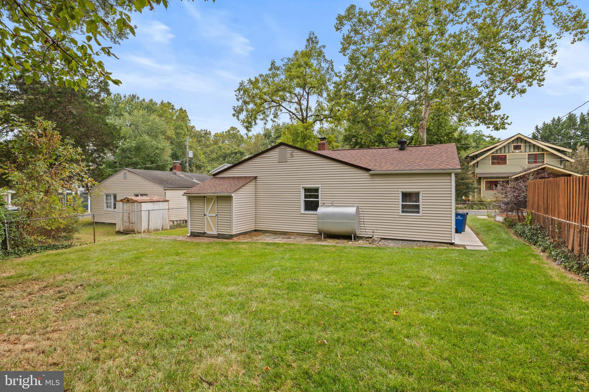 4 Russell Road Cabin John, MD 20818 - Photo 32 of 56 a view of a yard in front of a house with large trees