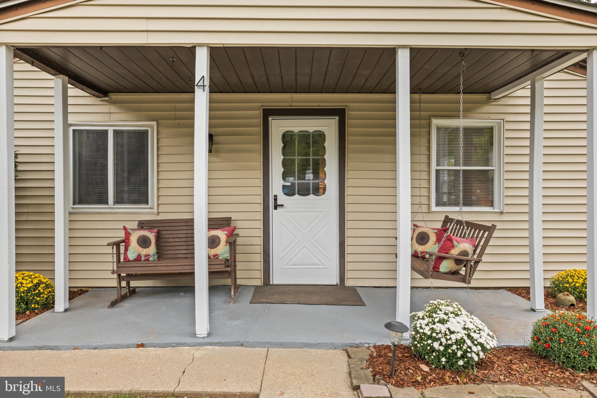 4 Russell Road Cabin John, MD 20818 - Photo 4 of 56 a view of a house with outdoor seating