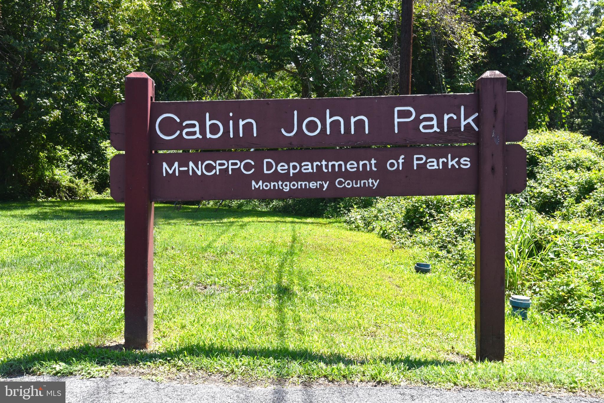 4 Russell Road Cabin John, MD 20818 - Photo 42 of 56 a sign broad in front of a red brick house