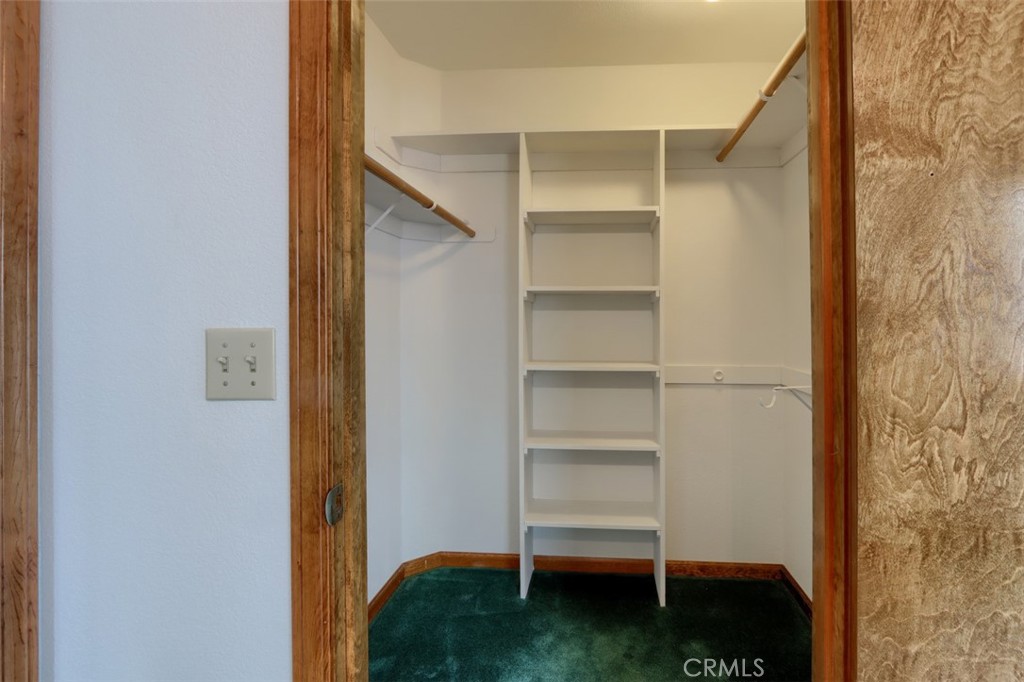 32786-32762 Road 221 North Fork, CA 93643 - Photo 26 of 73 a view of walk in closet with empty racks