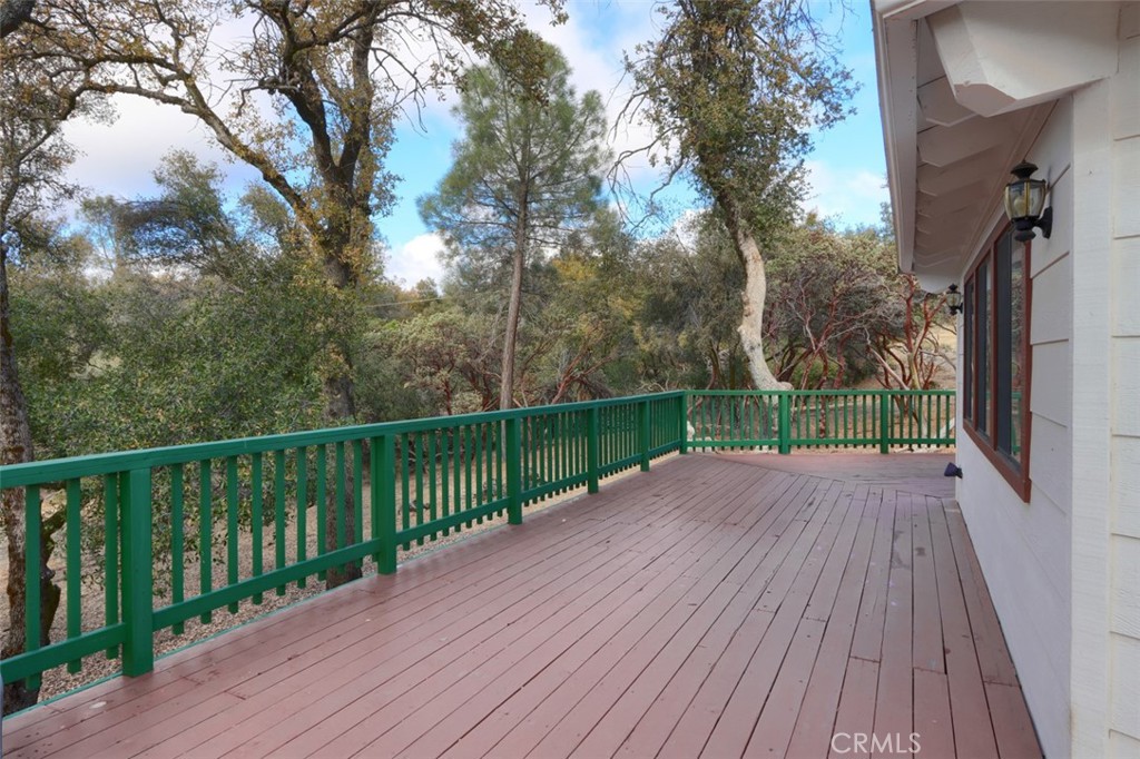 32786-32762 Road 221 North Fork, CA 93643 - Photo 32 of 73 a view of a deck with a trees