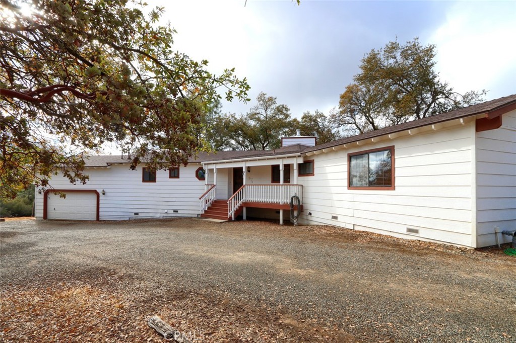 32786-32762 Road 221 North Fork, CA 93643 - Photo 35 of 73 a view of a house with a large tree and a car parked in front of it