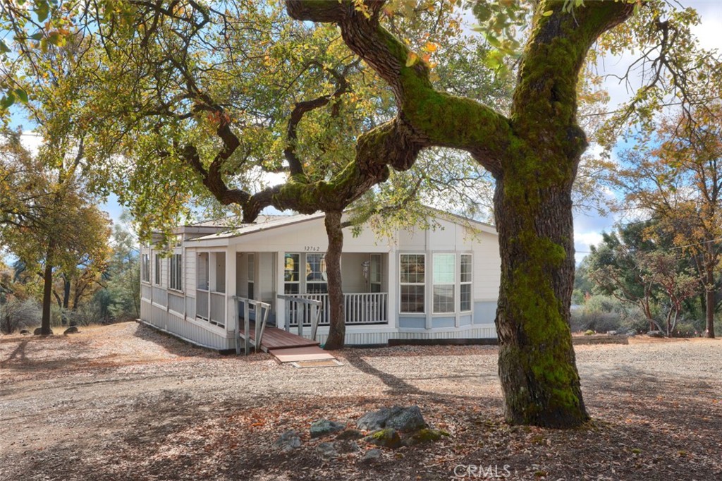 32786-32762 Road 221 North Fork, CA 93643 - Photo 4 of 73 a view of a house with a tree in the yard