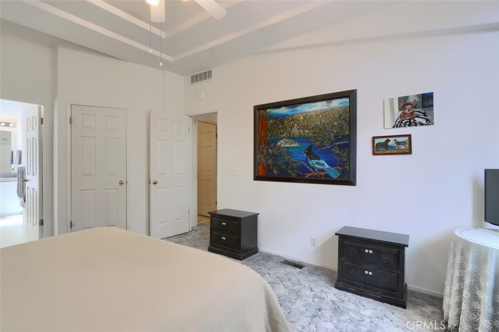 32786-32762 Road 221 North Fork, CA 93643 - Photo 60 of 73 a bedroom with a bed and painting on the wall