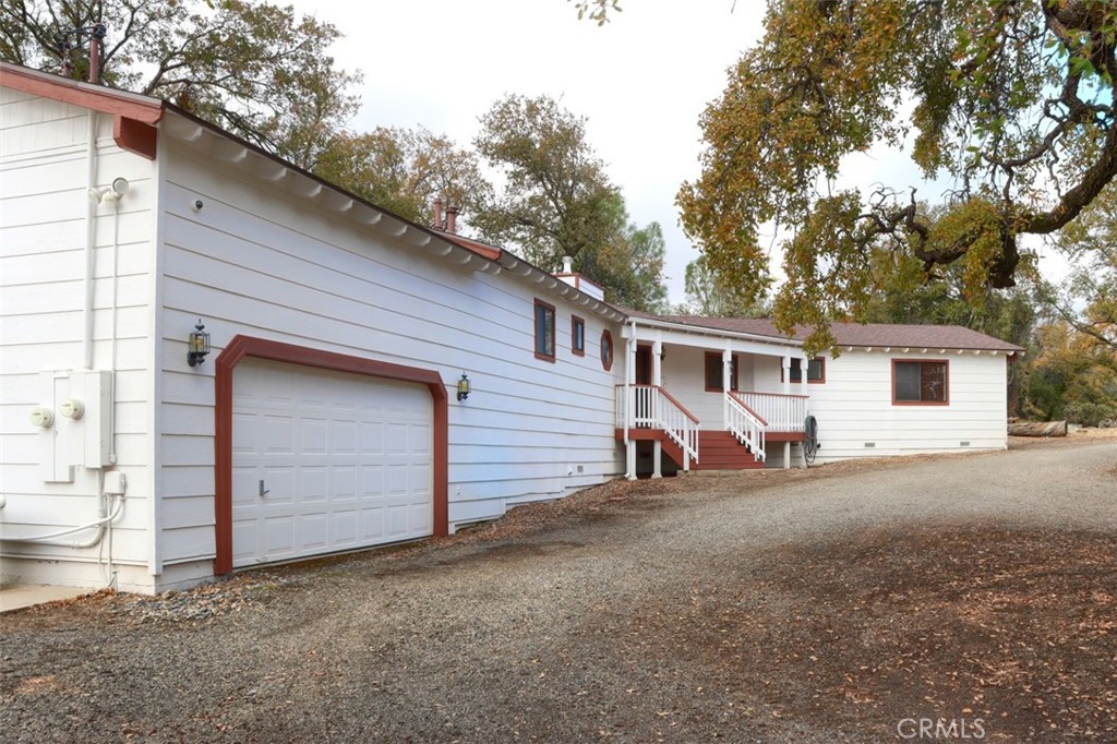 32786-32762 Road 221 North Fork, CA 93643 - Photo 7 of 73 a view of a house with a garage and yard