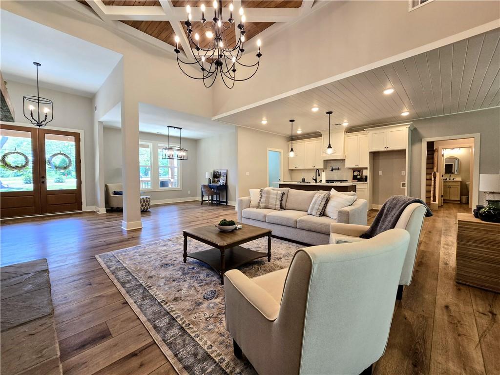 136 Rainey Road Temple, GA 30179 - Photo 22 of 75 a living room with furniture kitchen view and a wooden floor
