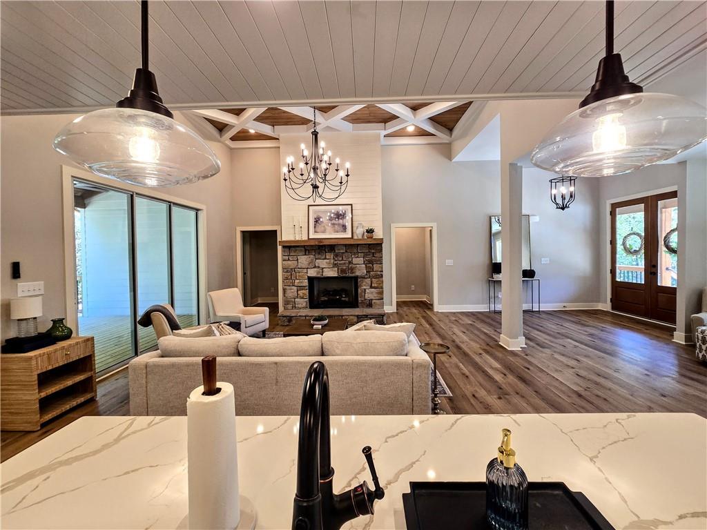 136 Rainey Road Temple, GA 30179 - Photo 23 of 75 a view of a livingroom with furniture a fireplace and wooden floor