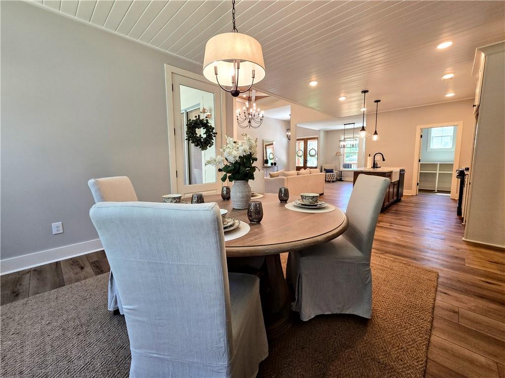 136 Rainey Road Temple, GA 30179 - Photo 28 of 75 a view of a dining room with furniture and wooden floor