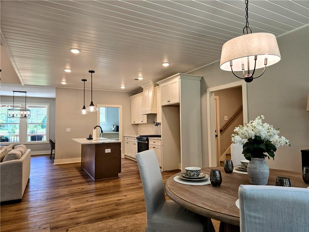 136 Rainey Road Temple, GA 30179 - Photo 29 of 75 a view of a dining room with furniture wooden floor and chandelier