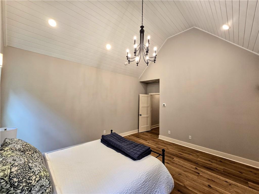 136 Rainey Road Temple, GA 30179 - Photo 37 of 75 a bedroom with a bed and a chandelier fan