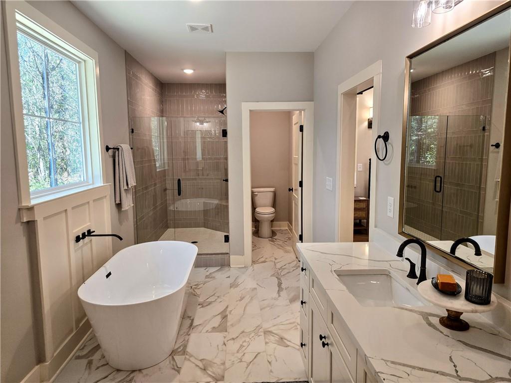 136 Rainey Road Temple, GA 30179 - Photo 41 of 75 a bathroom with a sink toilet and shower