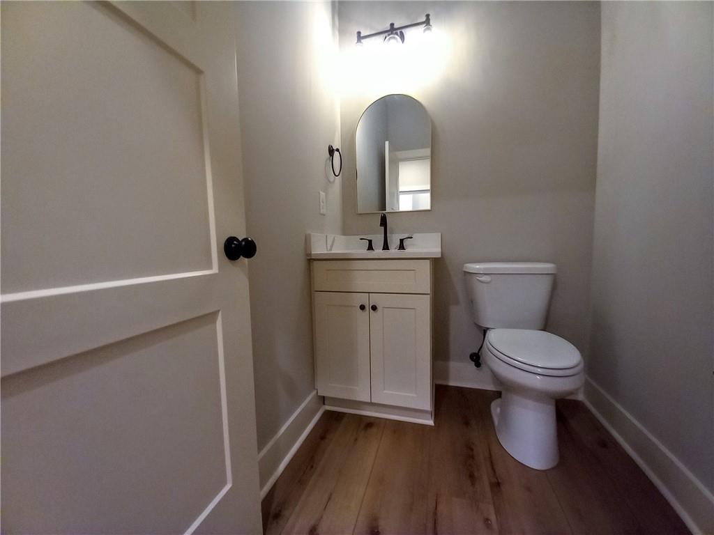 136 Rainey Road Temple, GA 30179 - Photo 45 of 75 a bathroom with a toilet a sink and mirror