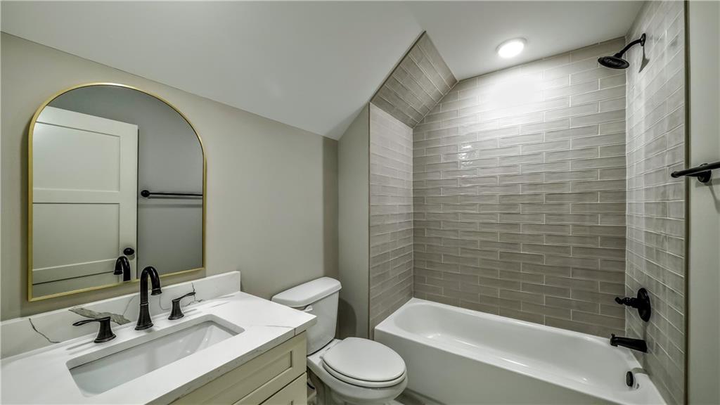 136 Rainey Road Temple, GA 30179 - Photo 48 of 75 a bathroom with a sink toilet and shower