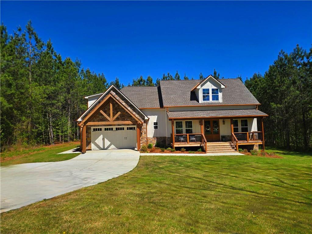136 Rainey Road Temple, GA 30179 - Photo 5 of 75 a front view of a house with a big yard
