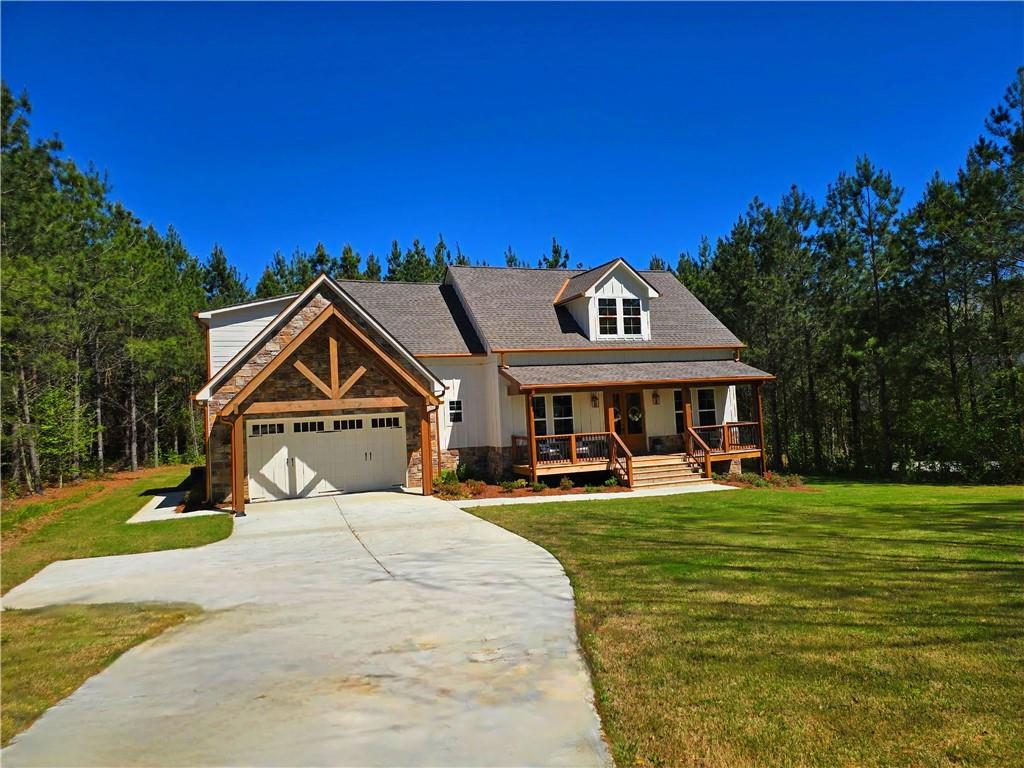 136 Rainey Road Temple, GA 30179 - Photo 6 of 75 a front view of a house with a yard